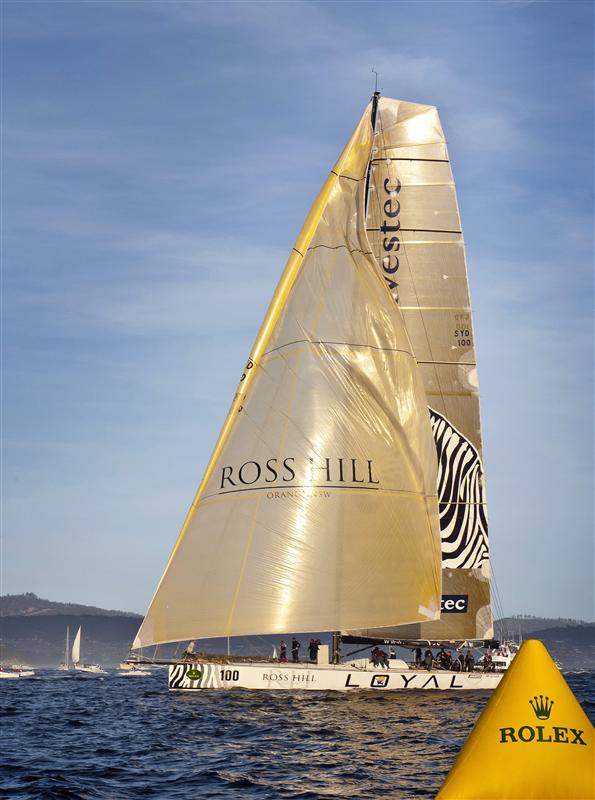 Line Honours Winner INVESTEC LOYAL crossing the finish line Photo K. Arrigo