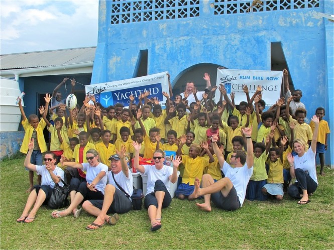 Motor yacht Slojo crew with Yacht Aid Global beneficiaries just after a delivery (photo by Captain Bruno Herregods)