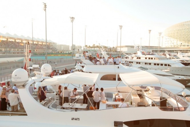 The crowds enjoy the racing from aboard at the Grand Prix