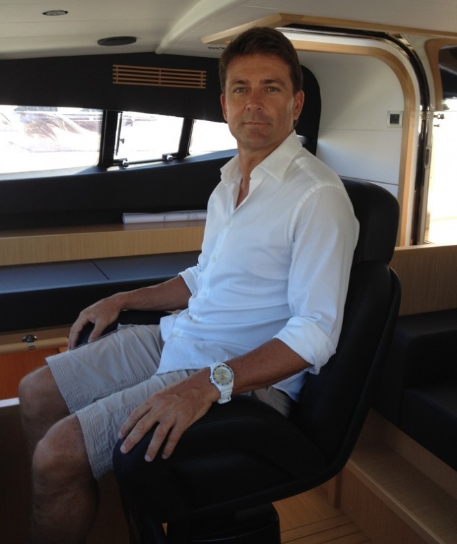 Josh Lee in the cockpit of the Ferretti 881 RPH superyacht