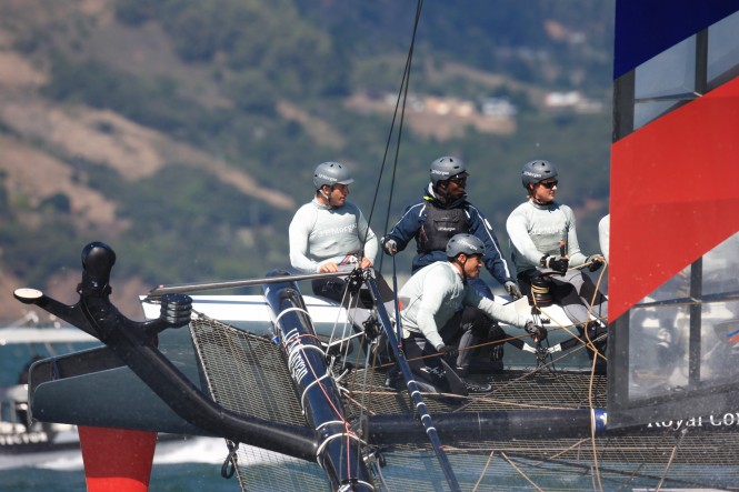Michael Johnson helms an AC45 on San Francisco Bay with Ben Ainslie sitting to his right