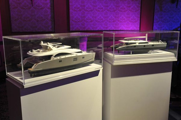 Models of luxury catamaran yachts by Sunreef on display during the event