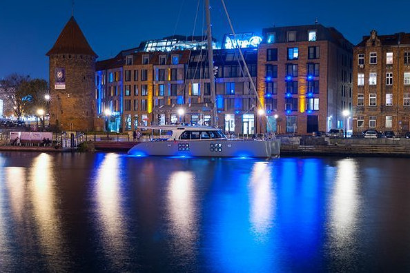 Sunreef 58 sailing yacht CARPE DIEM anchored at the embankment of the Hotel Hilton in Gdansk