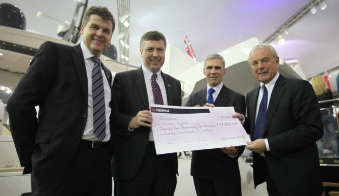 Cheque for £72,273 for Macmillan Cancer Support