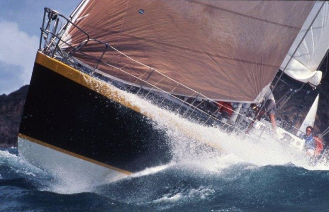 The leaping ‘Gherkin’: Jack Rooklyn’s maxi, Apollo, affectionately known as ‘The Gherkin’, bursts through a wave during the inaugural Hamilton Island Race Week in 1984. (Image: Sandy Peacock)