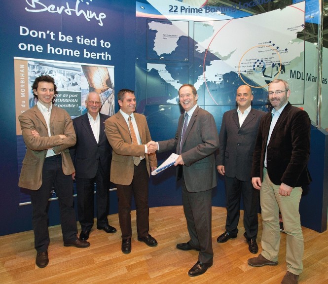 Signing of the contract - Jon Eads (left) and Arnauld Devys