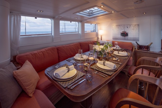 Royal Huisman Sailing Yacht Pumula - main deckhouse dining - Photo by Cory Silken