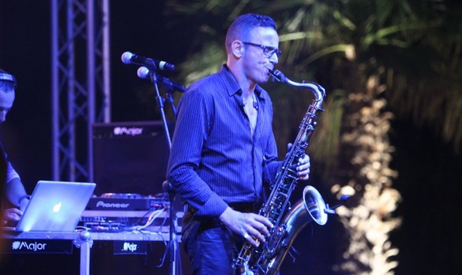 The saxophonist takes centre stage at the beach club party