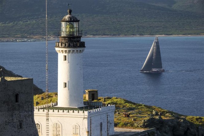 Superyacht Magic Carpet 3 rounds Giraglia Rock at 7am on the first morning of the offshore race - Photo by Rolex Carlo Borlenghi