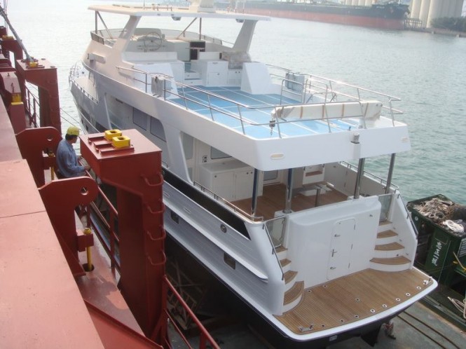 Outer Reef 700 Yacht being loaded on a ship in Kaohsiung, Taiwan