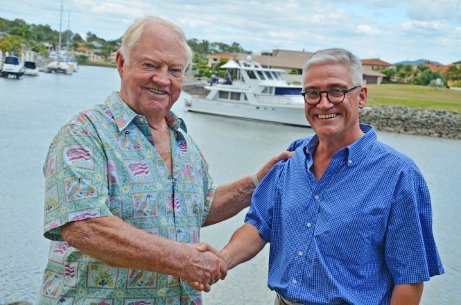 Gold Coast International Marine Expo president Stephen Milne (right) hands the reigns over to Gold Coast boating and business leader Patrick Gay