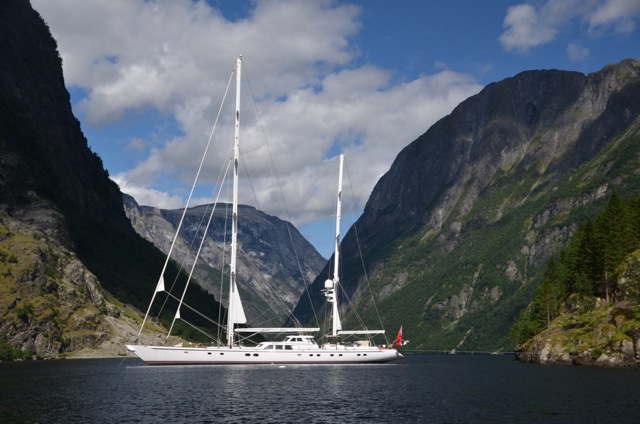 A superyacht cruising the Fjords