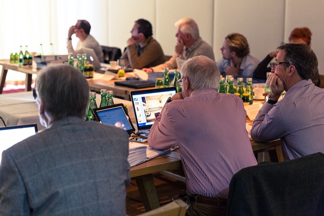 A selection of superyacht owners engrossed in the judging process