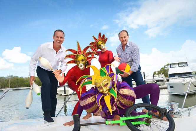 Rodney Longhurst and Wes Moxey on the bow of the Riviera 515 SUV with performers from Saturday night's Cirquetacular gala dinner