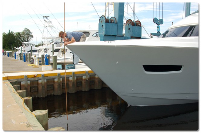 Viking's Joe Snodgrass takes bow and stern waterline measurements