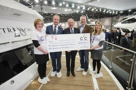 Cogs4Cancer present a cheque for €285,560.06 to Cancer Research UK at the London Boat Show. L to R – Chloe William (CRUK), Ben Young (President of C4C and MD of Sunseeker SYM), Robert Braithwaite CBE (Autumn Trust), Steve Crowe (C4C Rider and MD of Yachting Pages) & Felicity Louden (CRUK)