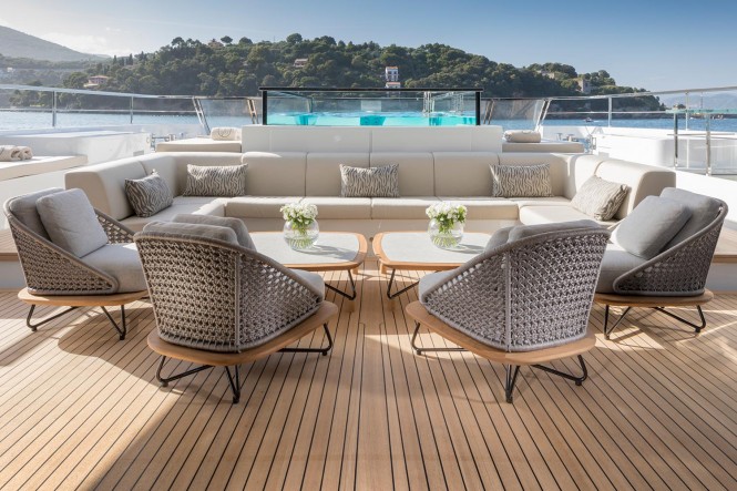 Luxury yacht SEVEN SINS - Main deck aft lounging area beside pool