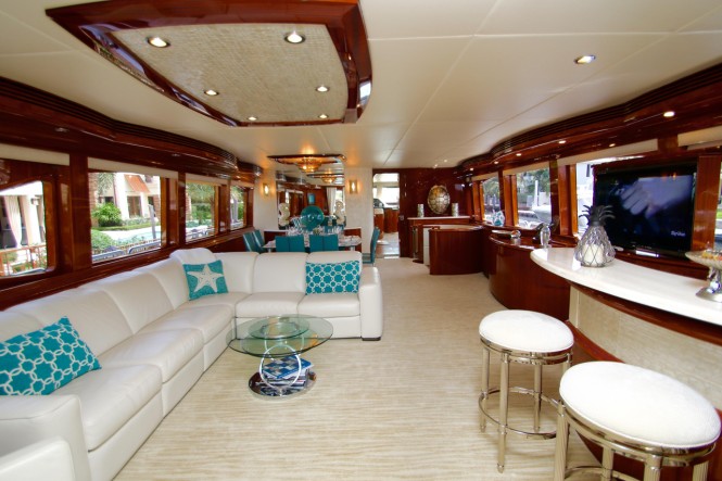 Luxury yacht EXIT STRATEGY - Salon and formal dining area with bar