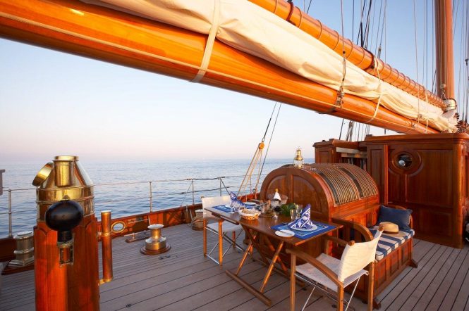 Aft deck alfresco dining aboard superyacht GERMANIA NOVA