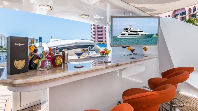 Deck bar with TV aboard CLAIRE