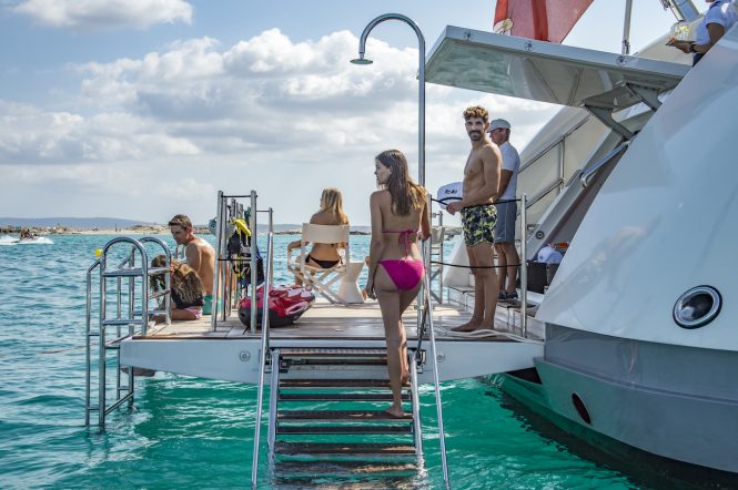 Enjoying the swim platform and beach club