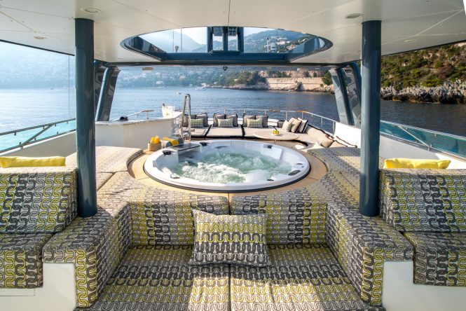 Sun deck with large Jacuzzi and sun pads