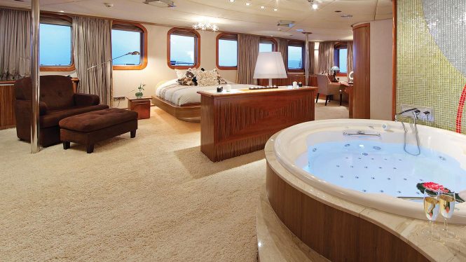 Master suite with a Jacuzzi hot tub en suite