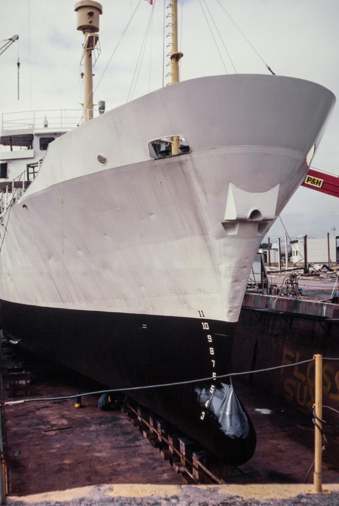 HMAS Flinders in the NQEA dry dock in Cairns, Queensland, Australia. Freshly cleaned and repainted hull is gleaming. Photo © Stephen Swayne