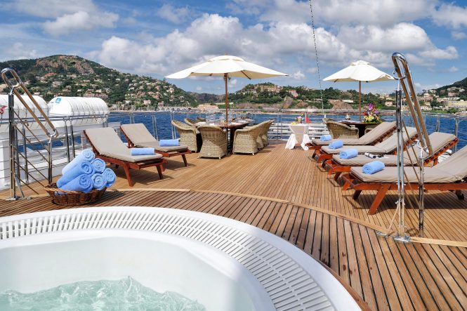 Deck area with Jacuzzi, sunbathing area and al fresco dining option