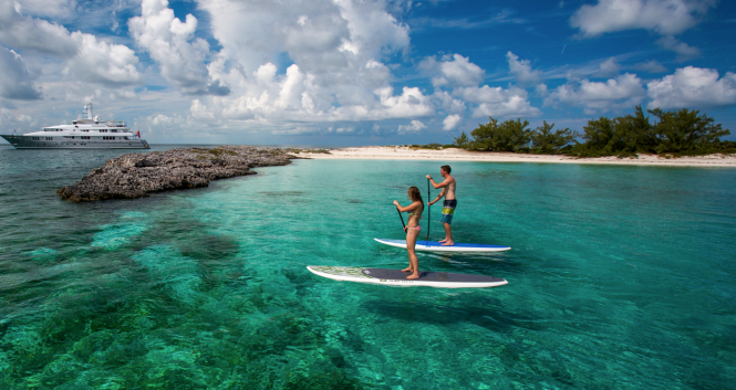 Paddle boarding in South Pacific on a superyacht charter