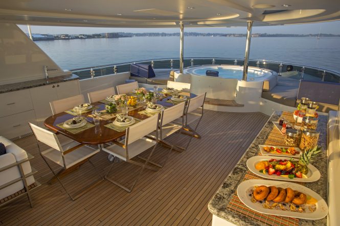 Sun deck with a Jacuzzi and an alfresco dining area © Billy Black Photography