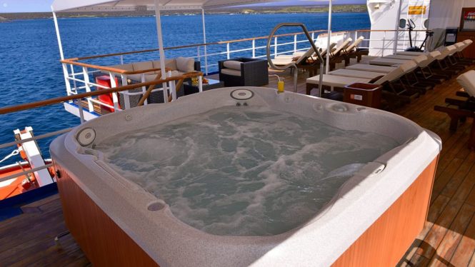 Plenty of sunbathing areas with on deck Jacuzzi