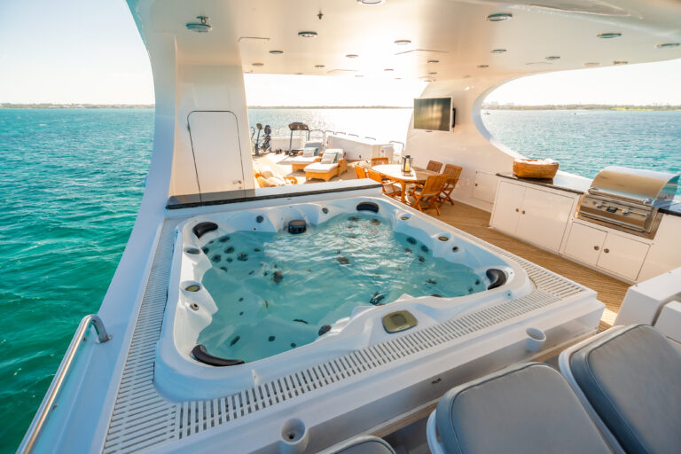 Sundeck with grill, jacuzzi, dining and gym