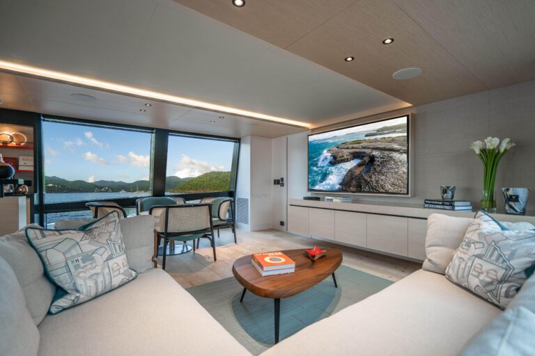 Large sofa and TV in main salon