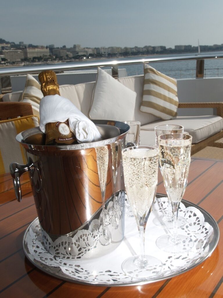 Champaign Glass: Yacht ALASKA OF GEORGE TOWN's Close Up Photograph