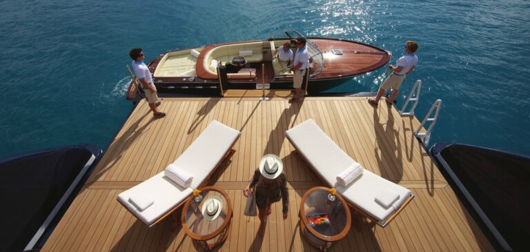 swim platform with tender and sunloungers