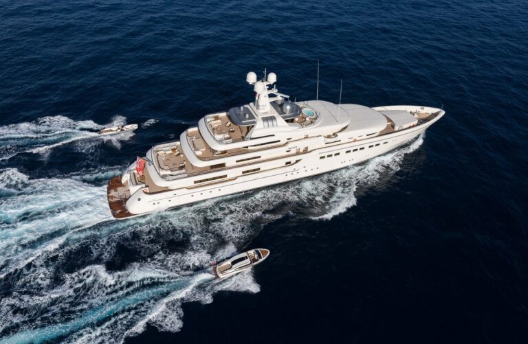 aerial view of the yacht cruising with water toys