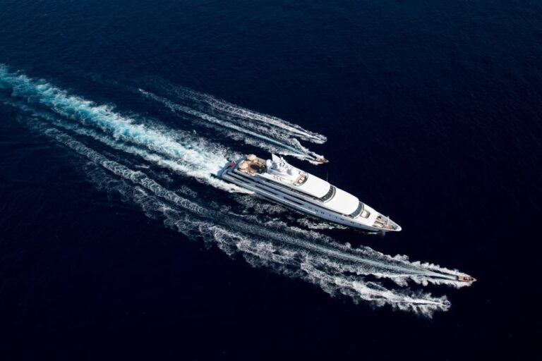 aerial view of the yacht cruising with water toys