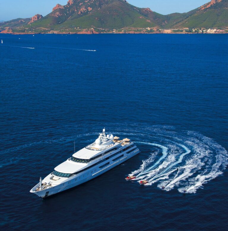 Aerial Including Ship's Tenders Approaching The Portside Profile On Yacht INDIAN EMPRESS