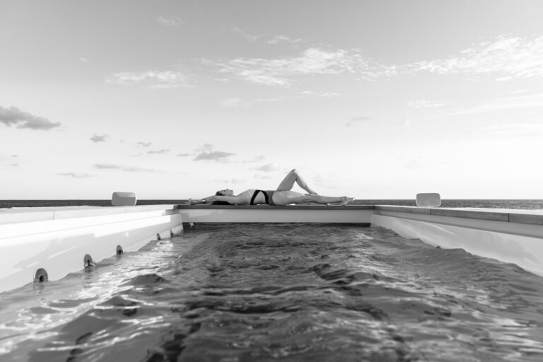 Lady Sunbathing At The Superyacht Pool