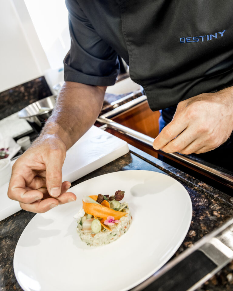 Chef Preparing Gourmet Meal For Guests
