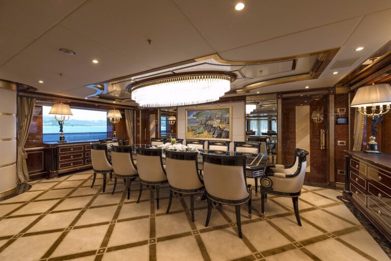 Formal Dining Area With A Beautiful Large Table And Plush Seating