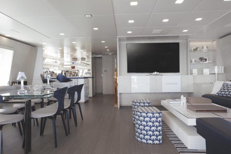 Upper Deck Lounge With TV And Dining Table On The Left