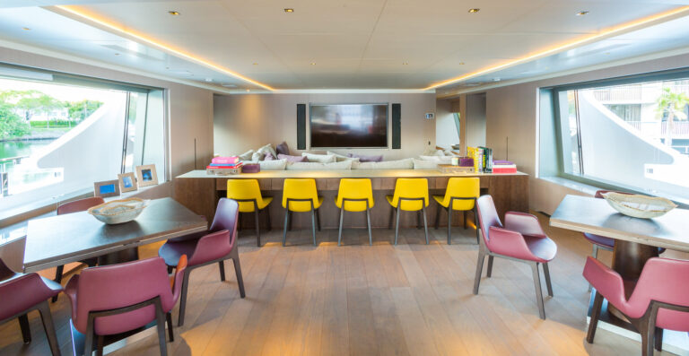 Upper Deck Saloon With Seating Areas And Tables