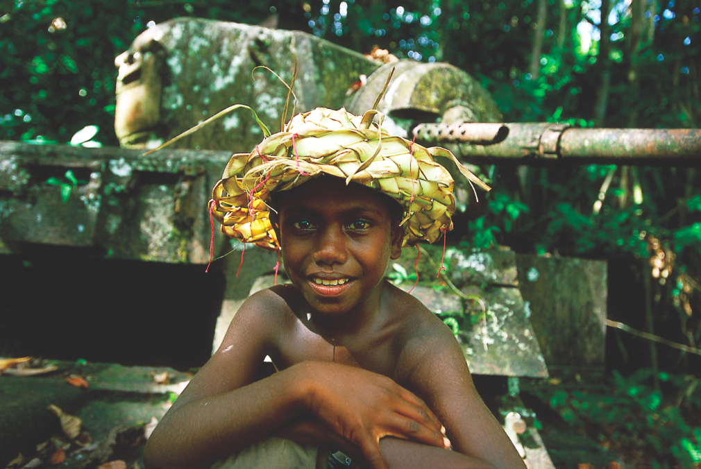  Local boy with Stuart Tank left in the jungle – Kohinggo Island, Western Province - Photo credit to Solomon Islands Visitors Bureau (SIVB)