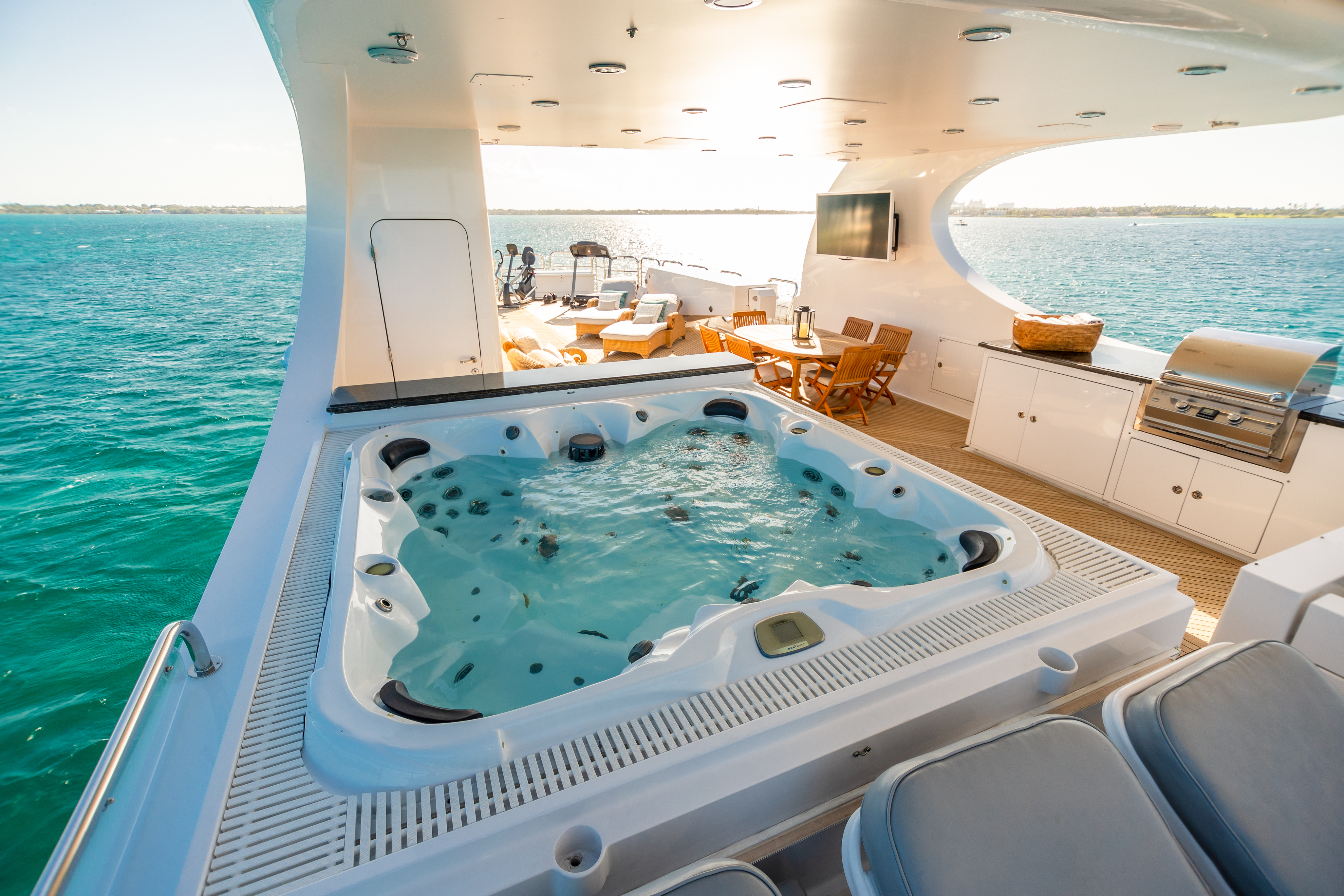 2.3 Sundeck with grill, jacuzzi, dining and gym.jpg
