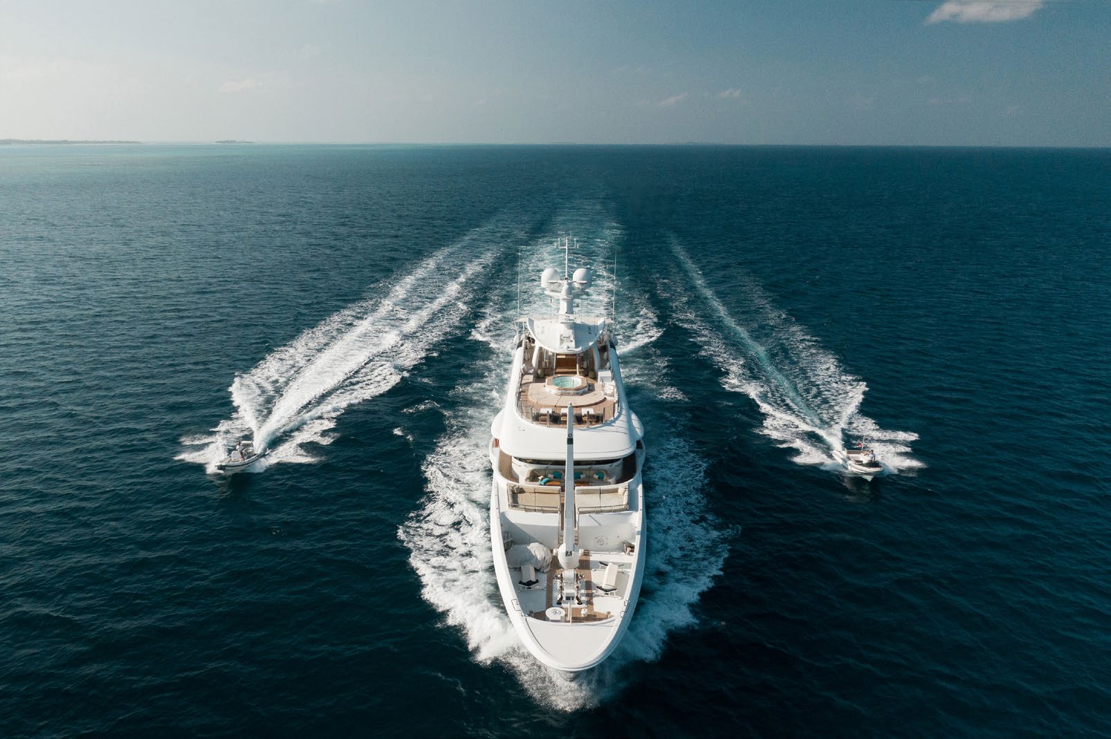 201 AMELS superyacht running with tenders.jpg