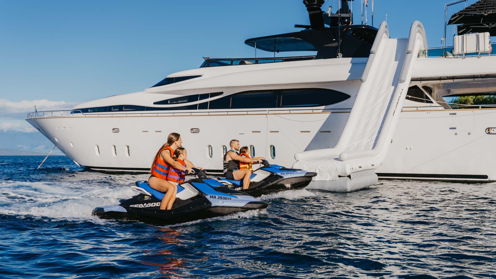 Cynthia with a waterslide and jetski.jpg