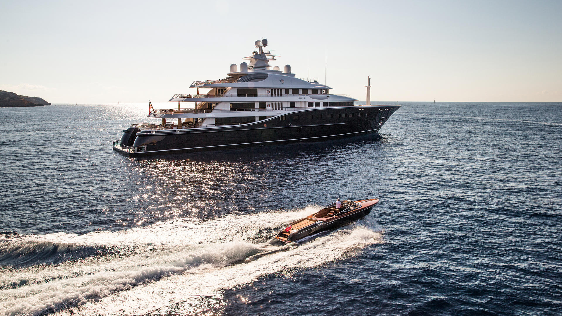 Profile at anchor with tender running Photo credit Rupert Peace.jpg