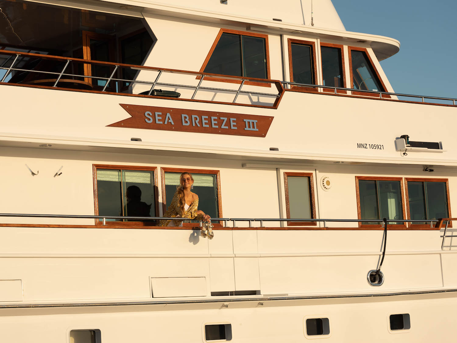 SEA BREEZE III with model on side deck.jpg